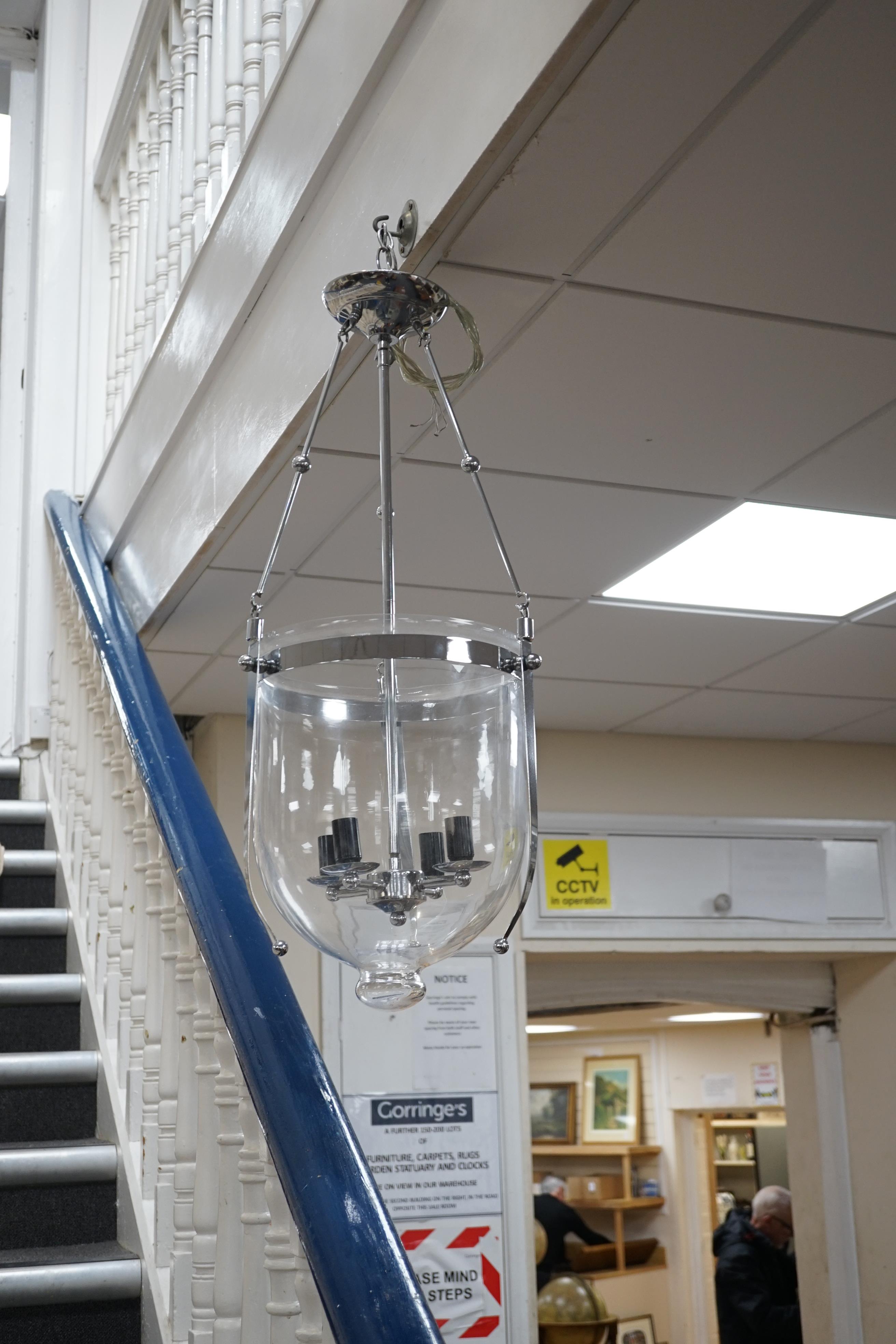 A pair of chrome plated and glass hanging lanterns